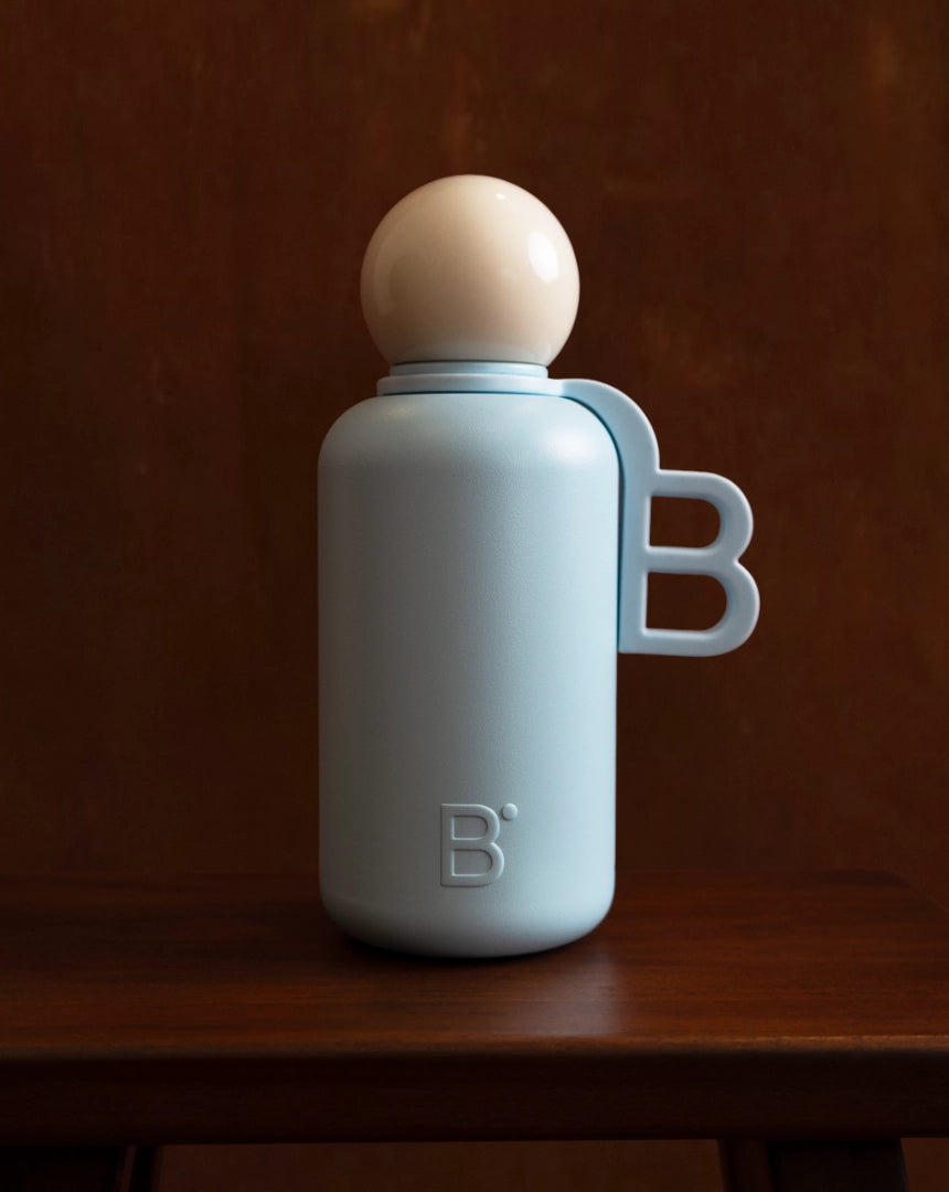 Alice luxury water bottle - pale blue stainless steel with rounded cap and handle