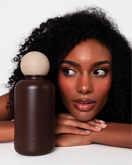 Woman with Paris luxury water bottle in dark brown stainless steel
